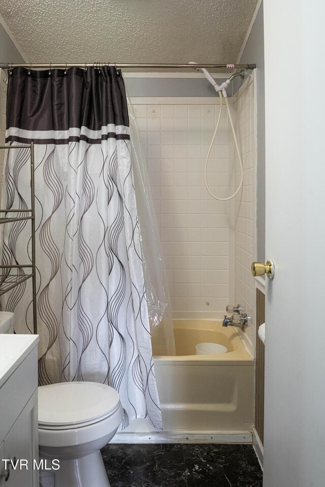 full bathroom with shower / bath combination with curtain, a textured ceiling, toilet, and vanity