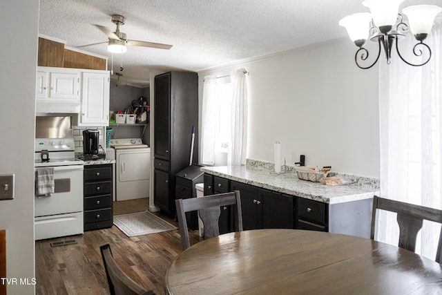 kitchen featuring ceiling fan with notable chandelier, washer / dryer, a textured ceiling, dark wood-style floors, and white range with electric stovetop