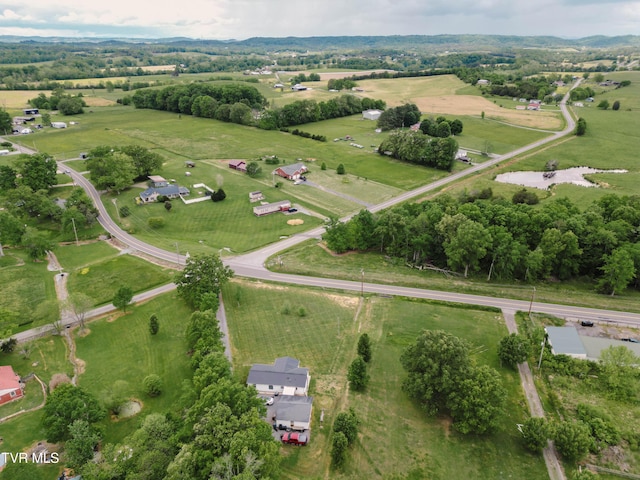 birds eye view of property with a rural view