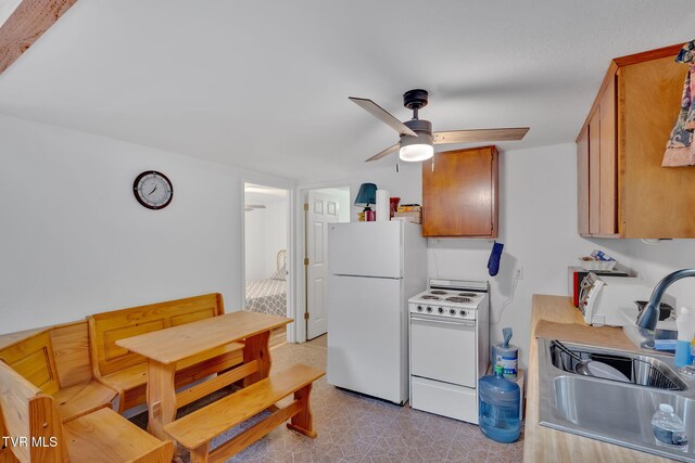 4331 Sentry Rd, Big Stone Gap, VA 24219 - kitchen featuring white appliances, a sink, a ceiling fan, brown cabinets, and light floors