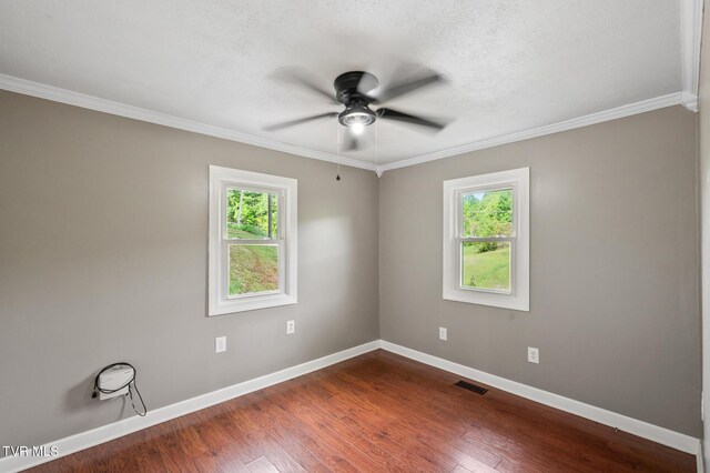 23249 Marys Chapel Rd, Bristol, VA 24202 - unfurnished room featuring plenty of natural light, a ceiling fan, baseboards, dark wood-style flooring, and crown molding