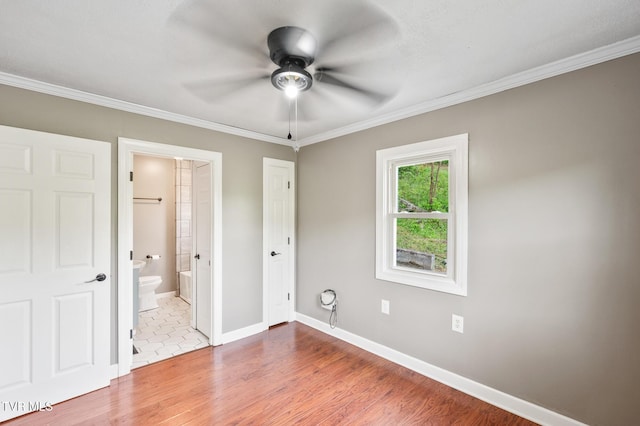 23249 Marys Chapel Rd, Bristol, VA 24202 - unfurnished bedroom featuring wood finished floors, crown molding, baseboards, ensuite bath, and ceiling fan