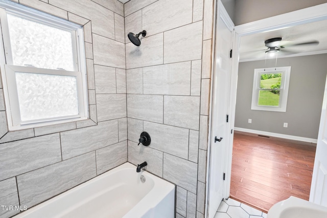 23249 Marys Chapel Rd, Bristol, VA 24202 - full bathroom featuring wood finished floors, ceiling fan, tub / shower combination, crown molding, and baseboards