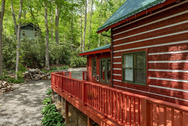 wooden deck featuring french doors