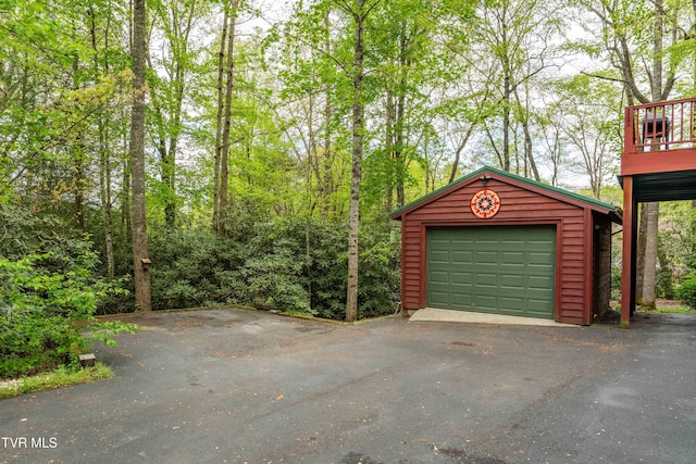 detached garage with aphalt driveway