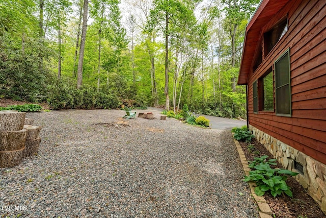 view of yard featuring a wooded view
