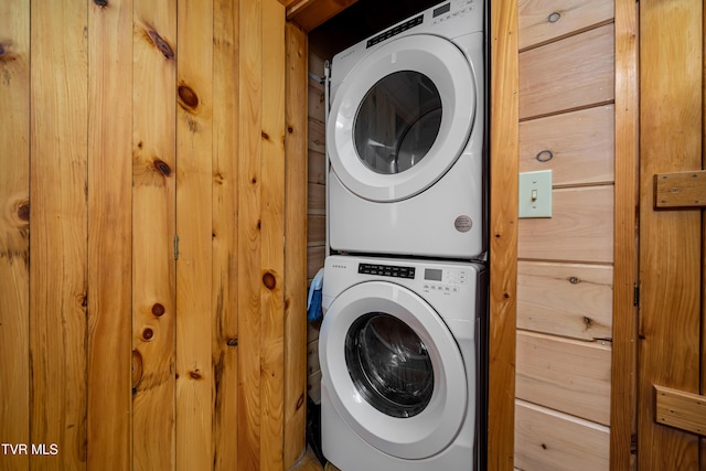 laundry area featuring laundry area and stacked washer / dryer