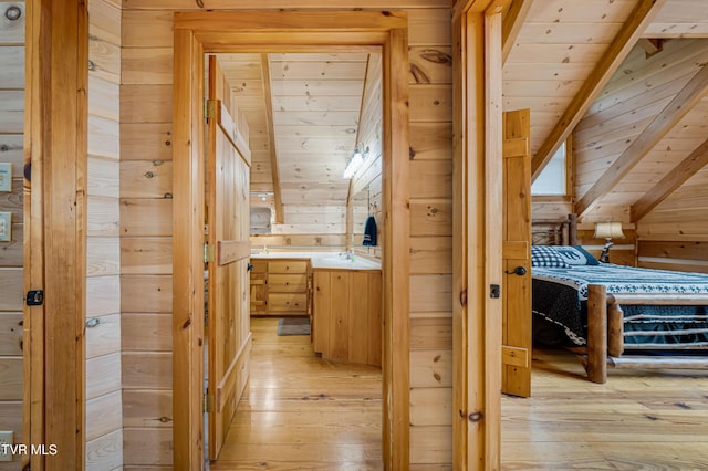bathroom with wood ceiling, wooden walls, and wood-type flooring