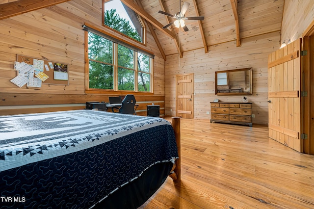 bedroom with wood ceiling, wooden walls, light wood-style flooring, and vaulted ceiling with beams