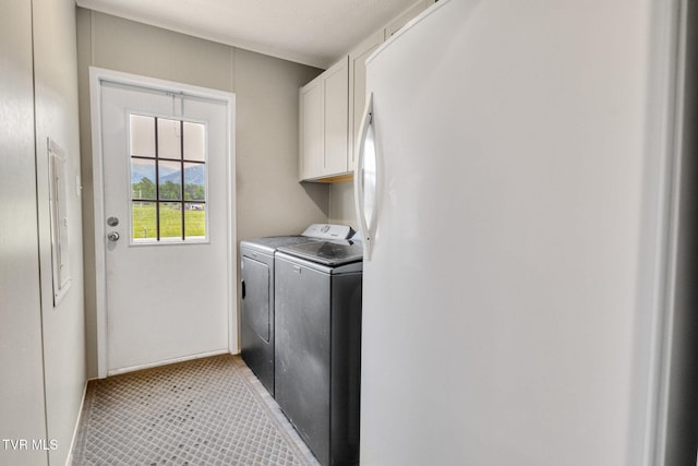 100 Colyer Rd, Greeneville, TN 37743 - laundry area with washer and dryer, cabinet space, and light tile patterned floors