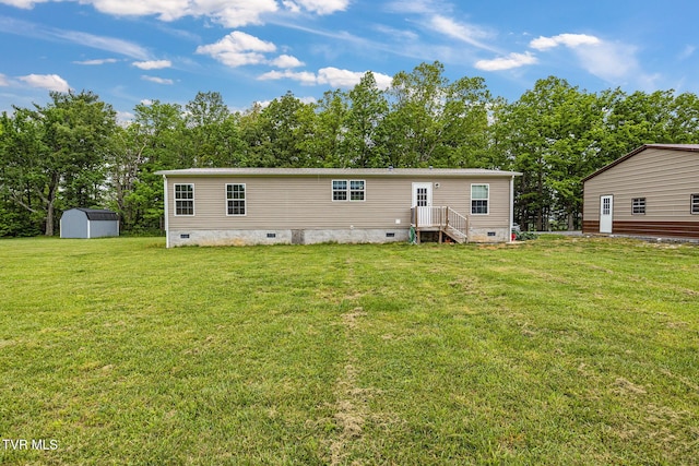 100 Colyer Rd, Greeneville, TN 37743 - rear view of house featuring crawl space, a lawn, and view of wooded area