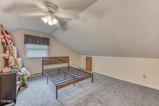 rec room featuring a textured ceiling, vaulted ceiling, ceiling fan, carpet flooring, and baseboards