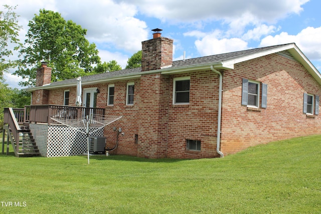 rear view of house featuring a chimney, stairs, a deck, and central AC