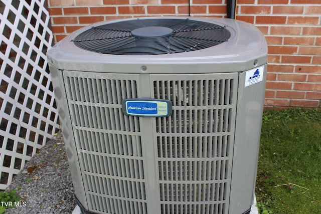 exterior view of cooling unit and brick siding