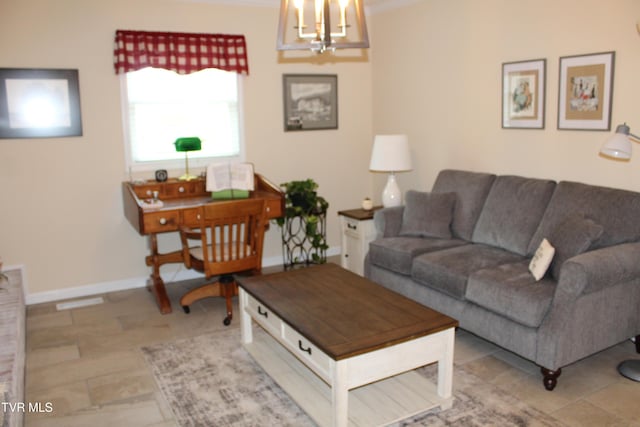 living room with a chandelier and baseboards
