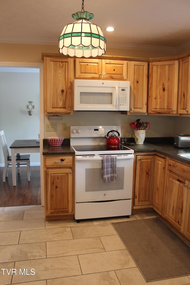 kitchen with white appliances, crown molding, dark countertops, hanging light fixtures, and recessed lighting