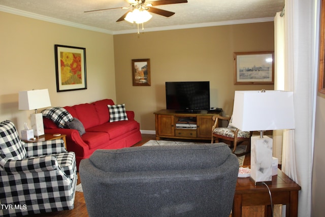 living room featuring a ceiling fan, crown molding, wood finished floors, and baseboards
