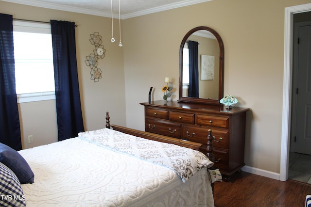 bedroom featuring wood finished floors, baseboards, ornamental molding, and arched walkways