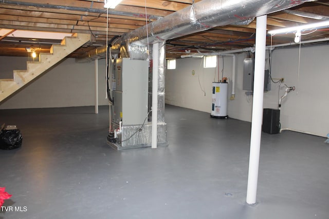 basement with electric water heater, stairway, heating unit, and electric panel