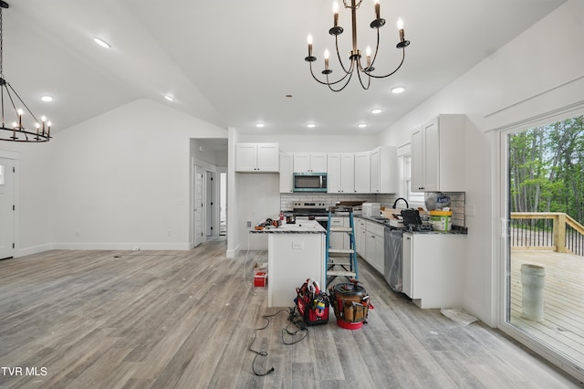 173 Paynetown Rd, Telford, TN 37690 - kitchen with a sink, stainless steel appliances, light wood-style floors, a chandelier, and lofted ceiling