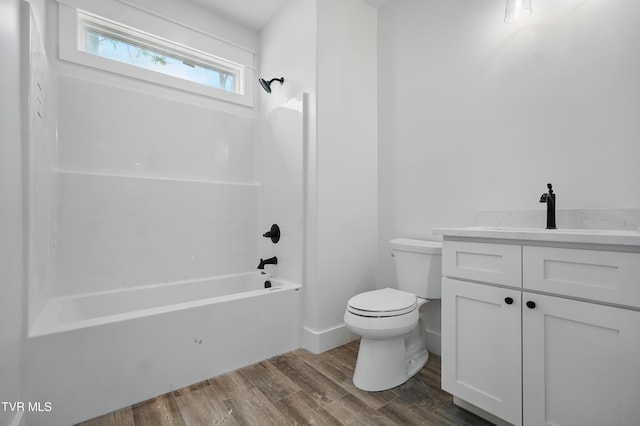 173 Paynetown Rd, Telford, TN 37690 - bathroom featuring shower / bath combination, vanity, toilet, and wood finished floors