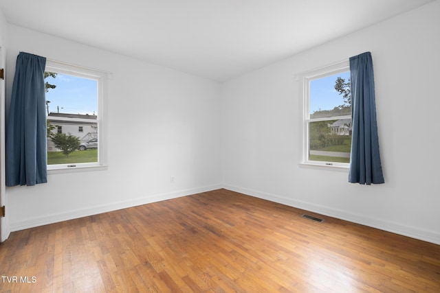 216 Sunbury Ct, Kingsport, TN 37664 - unfurnished room featuring healthy amount of natural light, hardwood / wood-style floors, and baseboards