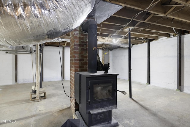 216 Sunbury Ct, Kingsport, TN 37664 - unfinished basement with a wood stove