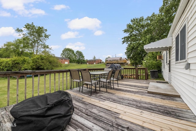 216 Sunbury Ct, Kingsport, TN 37664 - wooden deck featuring outdoor dining area, a yard, central air condition unit, and area for grilling