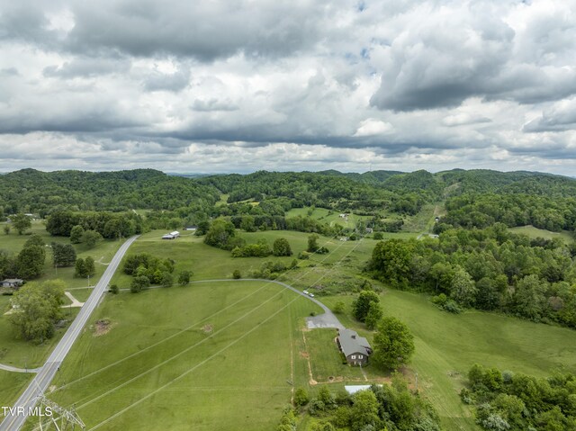view of rural area featuring a heavily wooded area
