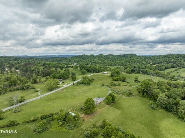 view of rural area featuring a forest
