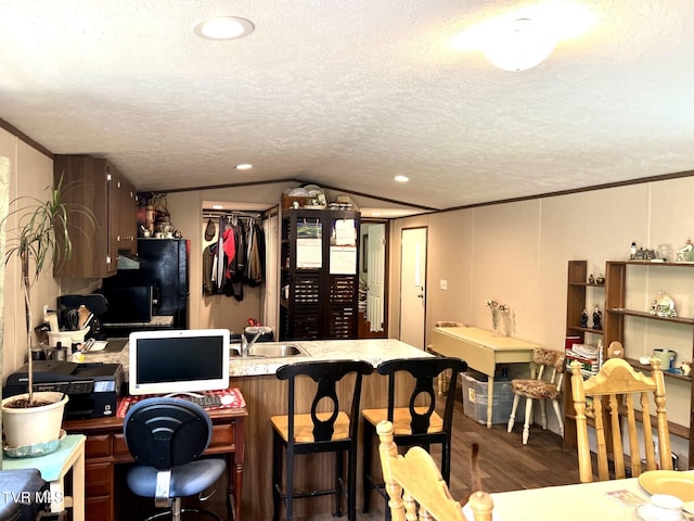 28529 US Highway 23, Big Stone Gap, VA 24219 - interior space featuring wood finished floors, freestanding refrigerator, crown molding, a textured ceiling, and vaulted ceiling