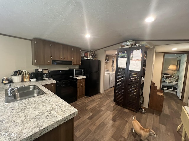 28529 US Highway 23, Big Stone Gap, VA 24219 - kitchen featuring a sink, independent washer and dryer, black appliances, under cabinet range hood, and light countertops