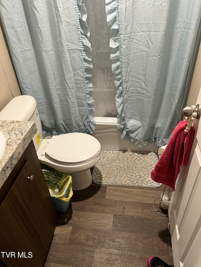 28529 US Highway 23, Big Stone Gap, VA 24219 - bathroom featuring vanity, toilet, shower / bath combination with curtain, and wood finished floors