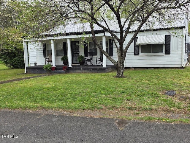 214 Elliott, Erwin, TN 37650 - view of front of house featuring covered porch and a front lawn