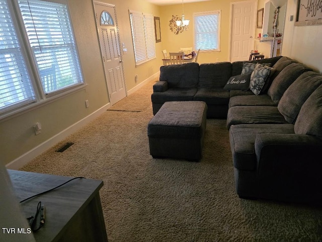 214 Elliott, Erwin, TN 37650 - living area with a chandelier, carpet flooring, and baseboards