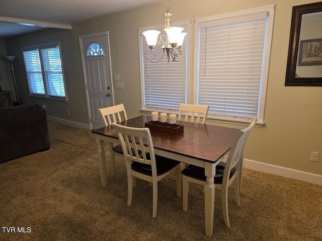 214 Elliott, Erwin, TN 37650 - carpeted dining space featuring a chandelier and baseboards