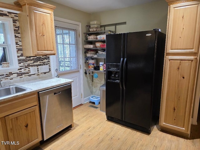 214 Elliott, Erwin, TN 37650 - kitchen featuring black fridge with ice dispenser, dishwasher, light wood finished floors, light countertops, and backsplash