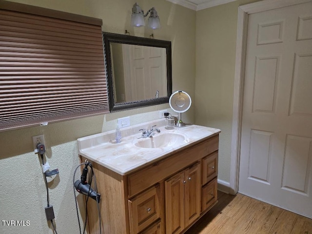 214 Elliott, Erwin, TN 37650 - bathroom with crown molding, vanity, and wood finished floors
