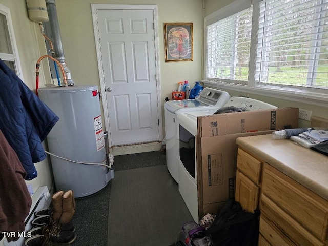 214 Elliott, Erwin, TN 37650 - washroom with gas water heater, washing machine and clothes dryer, cabinet space, and healthy amount of natural light