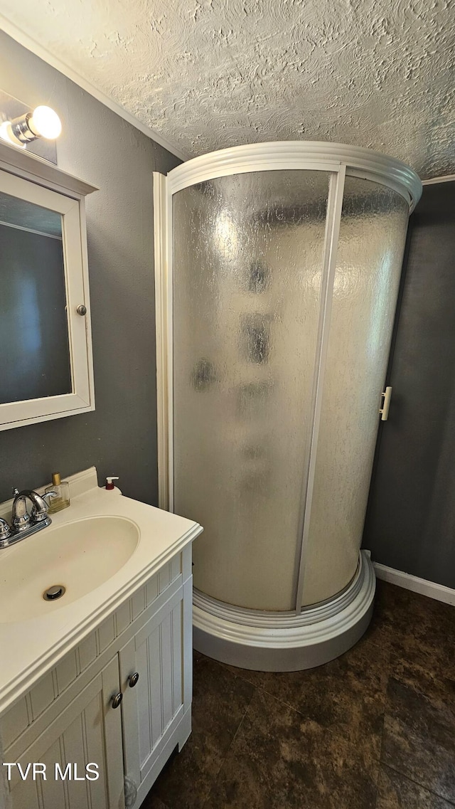 824 W Buckner Ave, Big Stone Gap, VA 24219 - bathroom with a stall shower, vanity, and a textured ceiling