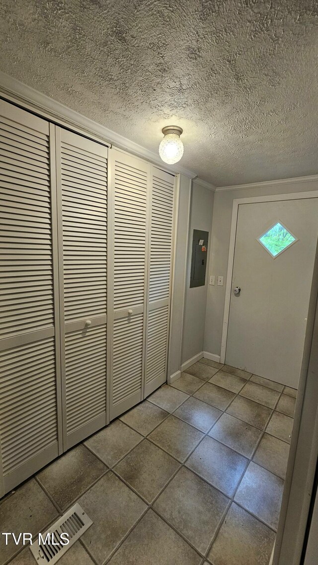 824 W Buckner Ave, Big Stone Gap, VA 24219 - hall featuring electric panel, a textured ceiling, baseboards, and crown molding