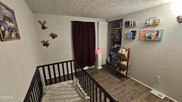 824 W Buckner Ave, Big Stone Gap, VA 24219 - stairs featuring a textured ceiling, wood finished floors, a textured wall, and baseboards