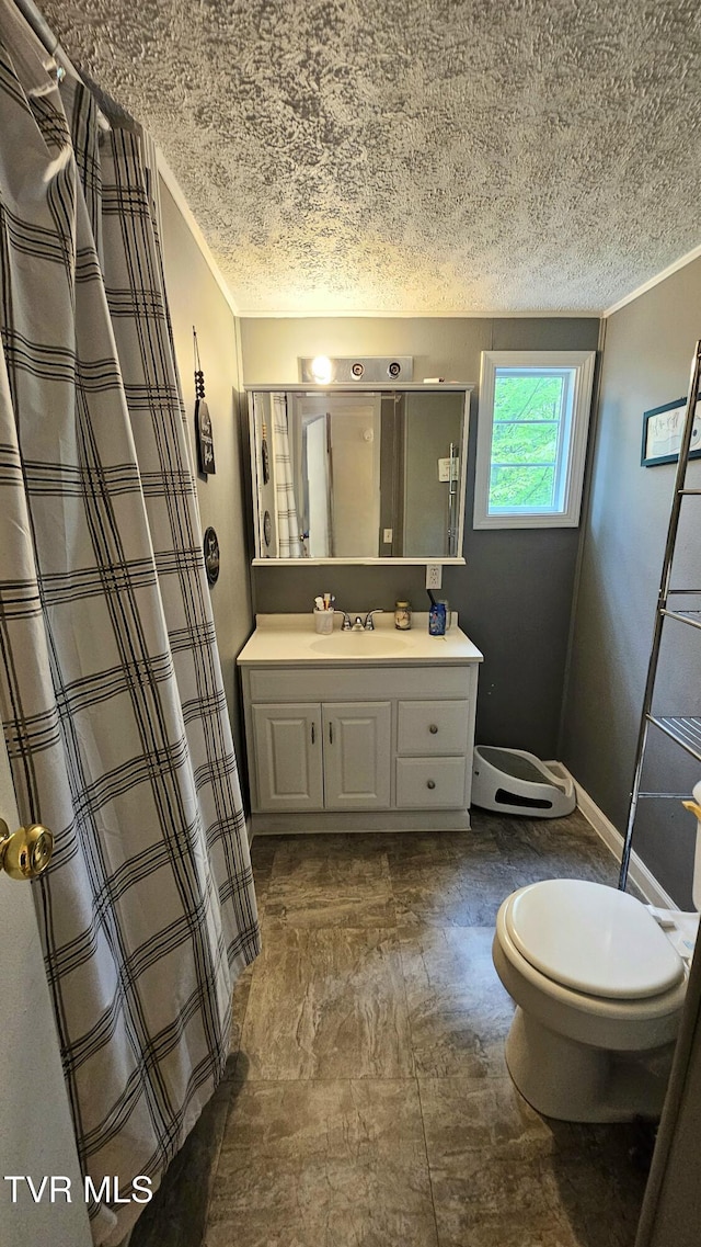 824 W Buckner Ave, Big Stone Gap, VA 24219 - bathroom with a textured ceiling, vanity, toilet, ornamental molding, and curtained shower