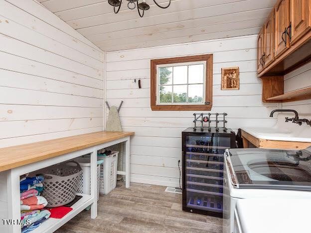 26354 Pewter Ln, Abingdon, VA 24211 - mudroom with wood finished floors, wooden walls, washer / clothes dryer, and wooden ceiling