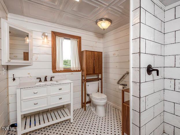 26354 Pewter Ln, Abingdon, VA 24211 - bathroom featuring toilet, vanity, and a tile shower