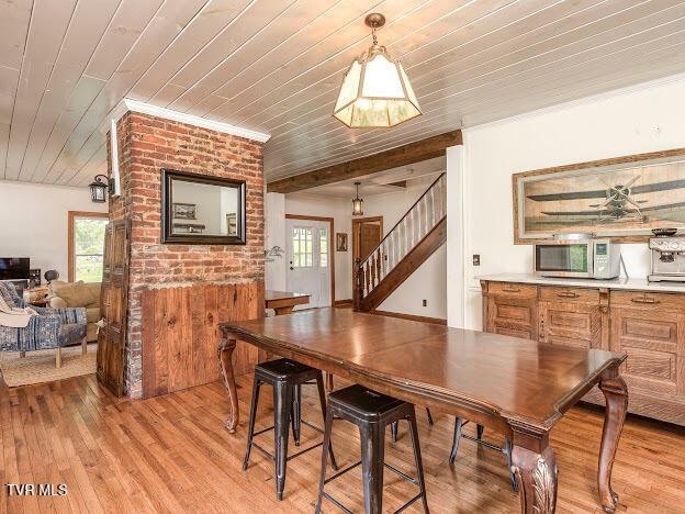 26354 Pewter Ln, Abingdon, VA 24211 - dining room with wooden ceiling, stairs, light wood-style floors, and ornamental molding