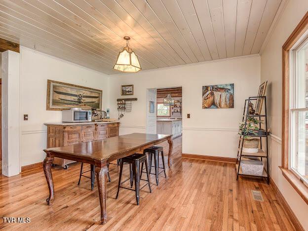 26354 Pewter Ln, Abingdon, VA 24211 - dining area featuring healthy amount of natural light, light wood-style floors, wood ceiling, and baseboards