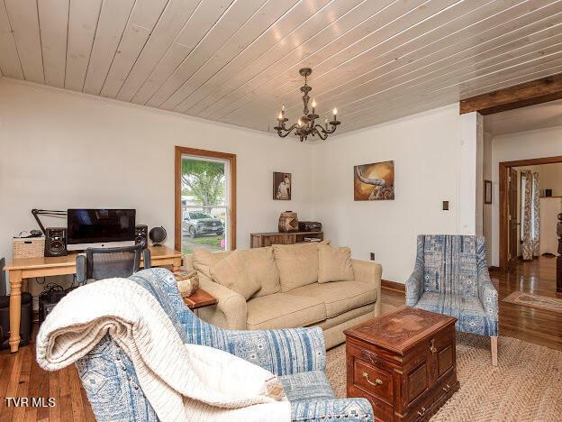 26354 Pewter Ln, Abingdon, VA 24211 - living area with a chandelier, wood finished floors, wood ceiling, crown molding, and baseboards