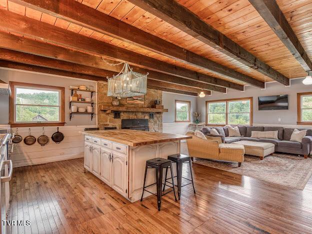 26354 Pewter Ln, Abingdon, VA 24211 - kitchen featuring wood counters, light wood finished floors, open floor plan, beam ceiling, and wood ceiling
