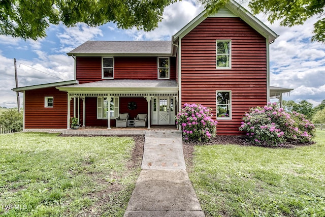 26354 Pewter Ln, Abingdon, VA 24211 - view of front of home with covered porch, a front yard, and a shingled roof